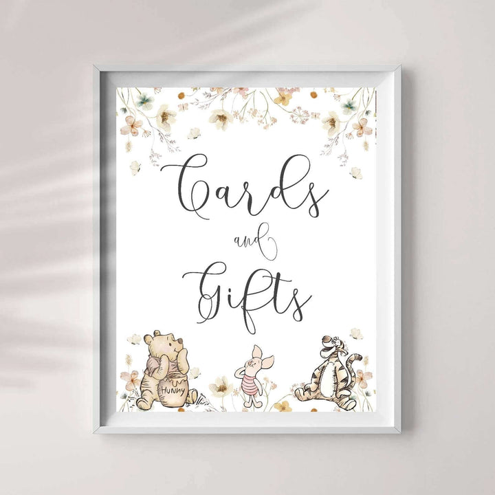 Winnie The Pooh cards and gifts sign with floral design for gender neutral baby shower decoration.