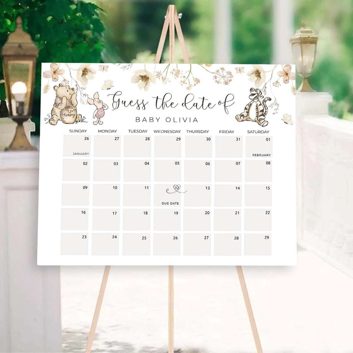 Winnie The Pooh baby due date calendar on easel, perfect for gender neutral baby shower birth date guessing game.