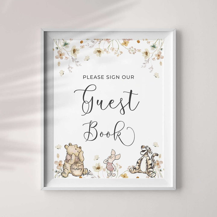 Winnie The Pooh guest book sign with floral border, perfect for gender-neutral baby shower party decorations.